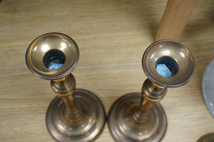 Two pairs of candlesticks to include 18th century brass ejector examples, 37cm wide. Condition - good